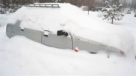 Passenger Car After Heavy Snowfall Grey Car In Deep Snow Blizzard