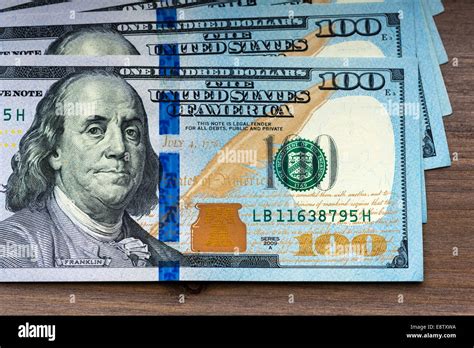 New Hundred Dollar Bills On Wooden Background Stock Photo Alamy