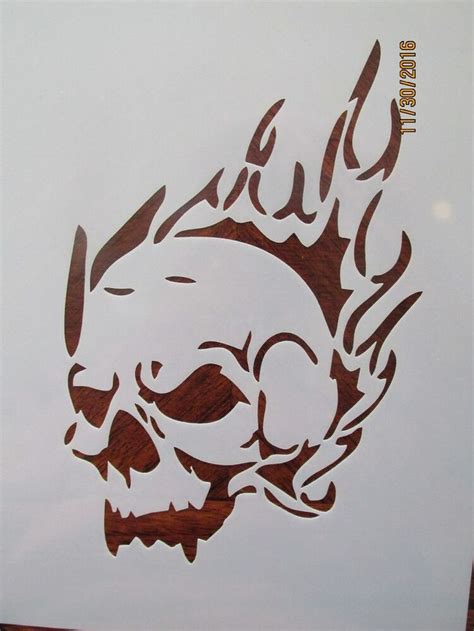 An Image Of A Sticker With A Skull And Flames On The Back Of It