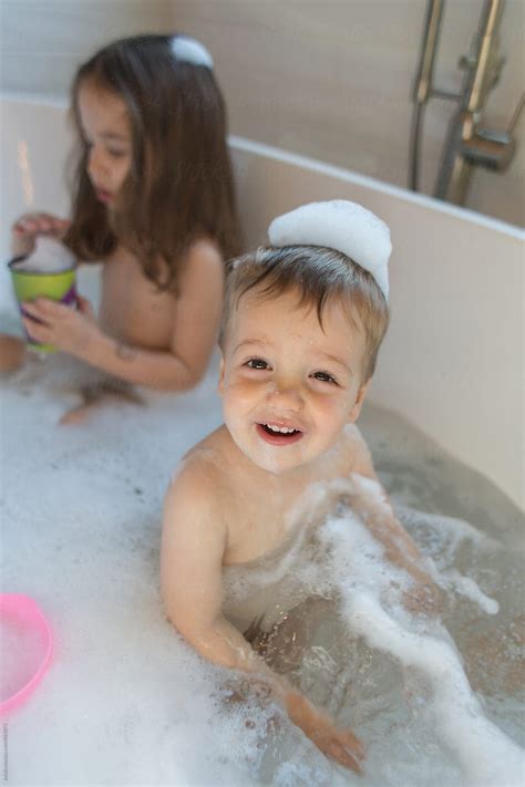 The best infant and toddler bathtubs. Cute boy toddler playing in a bathtub by Jakob Lagerstedt ...