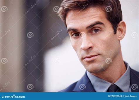 Urban Style Cropped Portrait Of A Handsome Businessman Standing