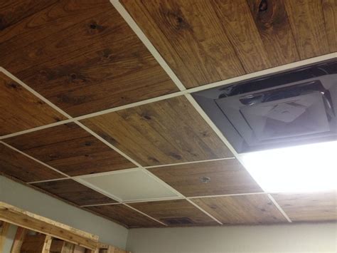 Hi everyone i have few questions regarding painting dropped ceiling tiles/grids with airless sprayer. Wooden slats replace ceiling tile. But paint hangers black ...