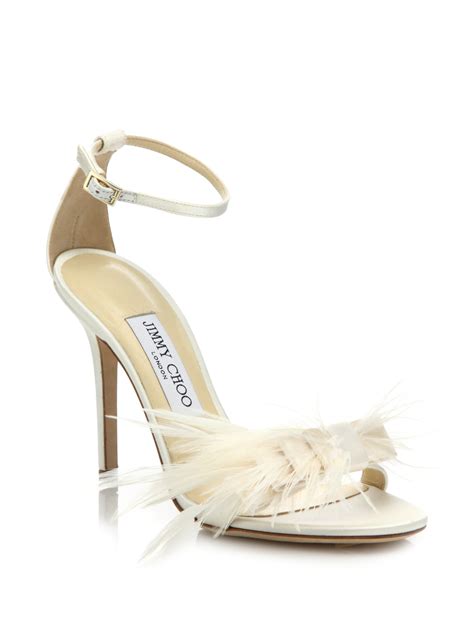 jimmy choo vivien ostrich feather bow satin sandals in natural lyst