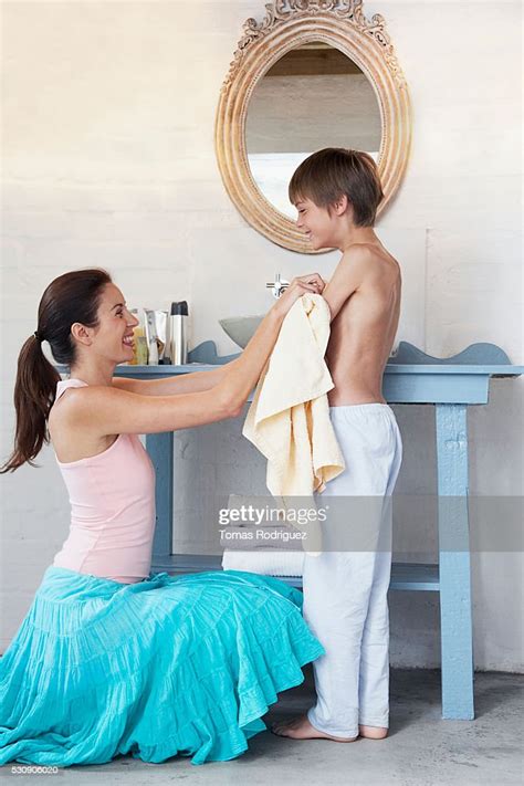 Mother And Son Dressing Photo Getty Images