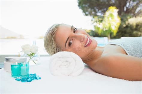 Beautiful Woman Lying On Massage Table At Spa Center Stock Image