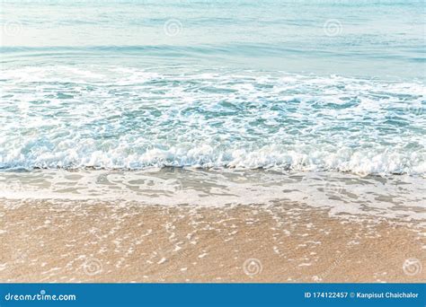 Soft Wave Of Blue Ocean On Sandy Beach Background Selective Focus