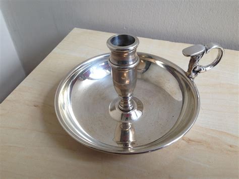 Don't let any water boil over into your wax. Antique style EPNS candle holder with carry handle ...