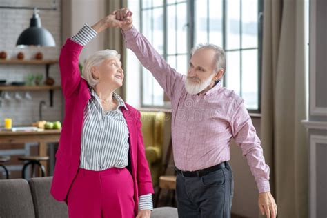 Happy Elderly Couple Dancing And Enjoying Their Day Stock Photo Image