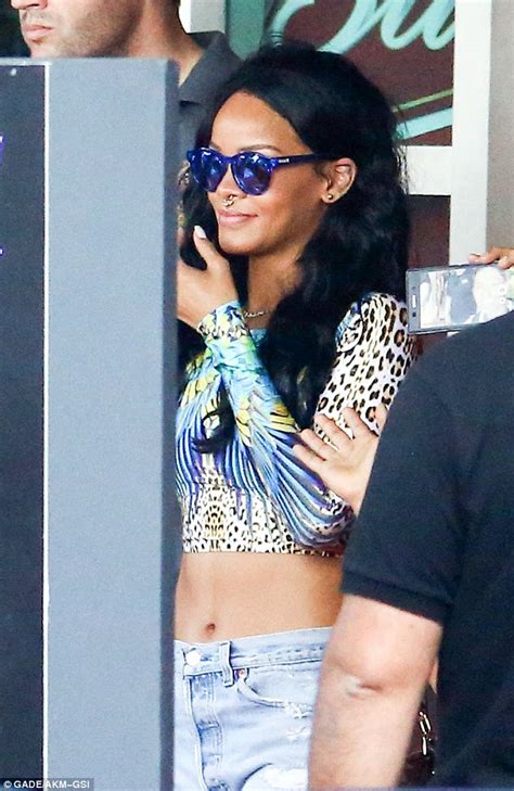 Rihanna Flaunts Her Taut Tummy To Her Fans As She Leaves Rio Hotel