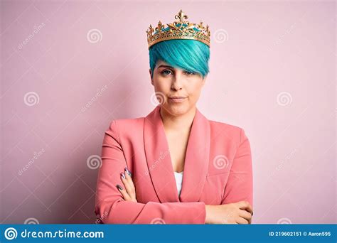 Young Business Woman With Blue Fashion Hair Wearing Queen Crown Over