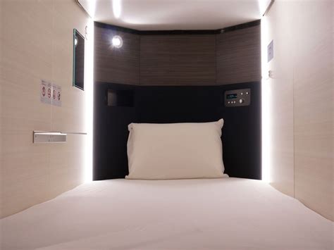 Rows of sleeping capsules in tokyo ginza bay hotel — photo by julie fader. 9 Capsule Hotels In Tokyo Under $70/Night For Solo Travellers On A Budget