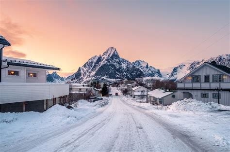 Small Snowy Houses In A Town With Amazing Sky And Mountains Free Photo