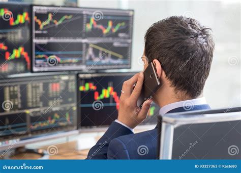 Over The Shoulder View Of Stock Broker Trading Online Talking On