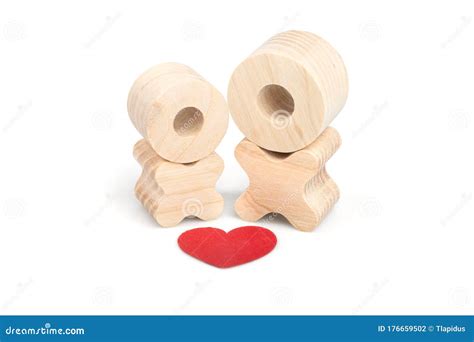 Two Wooden Figures And A Red Heart Above Them The Concept Of Love And
