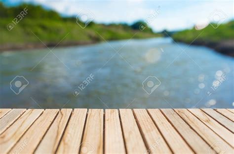 Empty Wood Deck With River Background With Natural Scenery Stock Photo