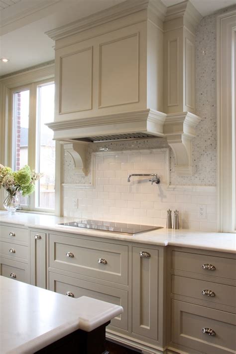 The elephant gray has a cool tone and appears natural. Light Gray KItchen Cabinets - Transitional - kitchen - Designer Friend