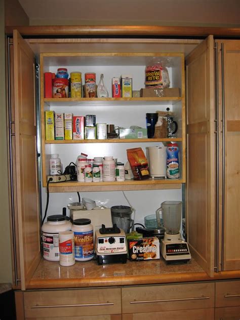 While i like the idea of a pantry, i don't like the idea of making the dining room darker and smaller. Appliance garage doors //garage in pantry | Appliance ...