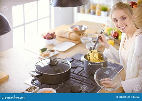 Beautiful Young Woman Cooking In Kitchen At Home Stock Photo Image Of