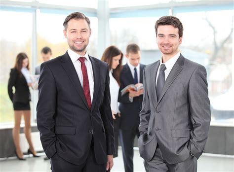 Two Business Men Working Together In The Office Curnow Law