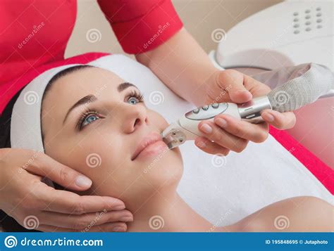 Rejuvenating Facial Treatment Model Getting Lifting Therapy Massage In A Beauty Spa Salon Stock