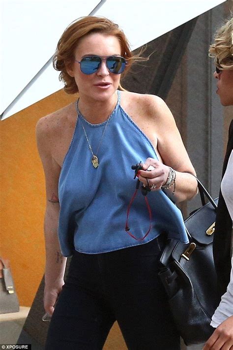 Lindsay Lohan Flashes Side Boob As She Goes Bra Less In Halterneck Top