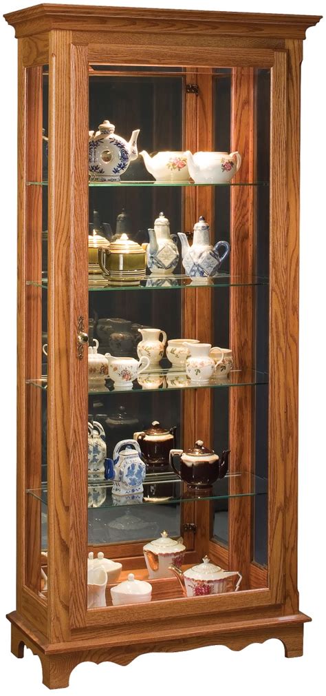 This jenlea lighted standing corner curio cabinet looks like a classic heirloom piece and would go well with any decor. 705 Curio Cabinet - Town & Country Furniture