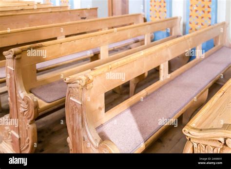 Wooden Benches In Catholic Church Stock Photo Alamy