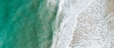 Download Wallpaper 2560x1080 Beach Sea Water Waves Foam Aerial