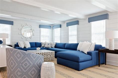 This coffee table, as lovely as it is, is way out of proportion with our sofa, and we lose our ability to easily move around the space. Blue Sectional with White Coffee Table - Cottage - Living Room