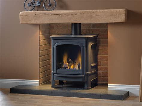 In this case the burner is usually hidden by faux logs that in turn help the flames spread evenly. Gas Stoves | Contemporary and Traditional Fireplace By Capital