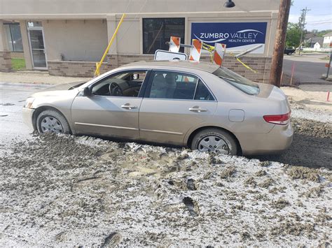 Woman Tries To Flee Police Drives Into Wet Concrete And Gets Stuck