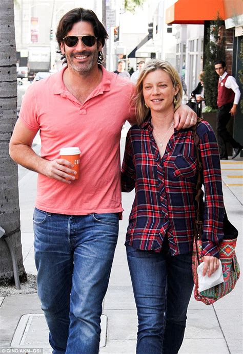 amy smart dresses down as she cosies up to husband carter oosterhouse daily mail online