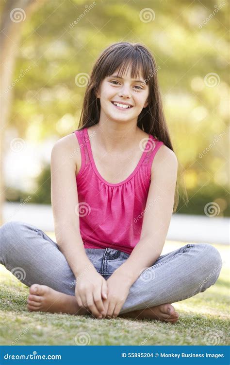 Girl Sitting On Grass In Summer Park Stock Photo Image