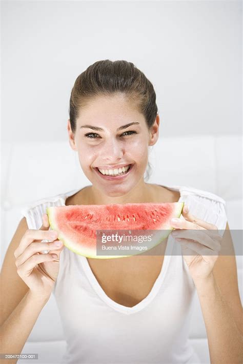 Young Woman Eating Watermelon Portrait High Res Stock Photo Getty Images