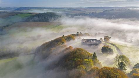 Autumn Mist Above Restormel Castle In Cornwall England © Robert