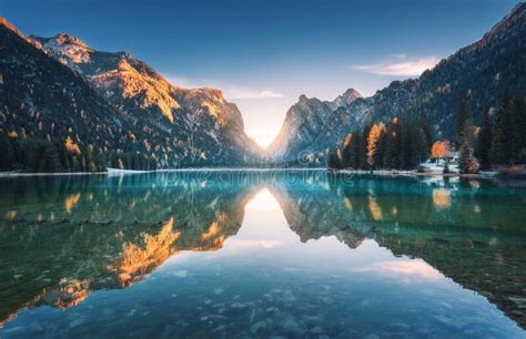 Lake In Fog With Reflection Of Mountains At Sunrise In