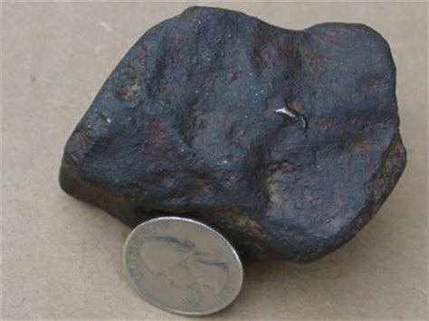 Some primitive meteorites have little round pieces of stony material in them. meteorite identification