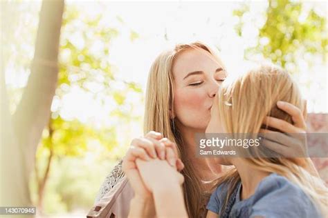 Mother And Daughter Making Out Photos And Premium High Res Pictures
