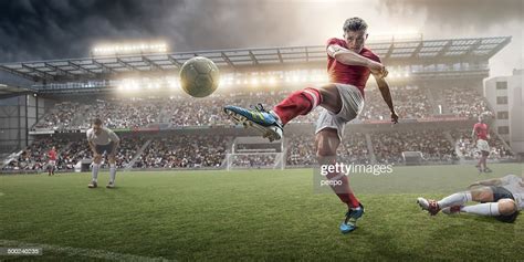Soccer Player Kicking Ball High Res Stock Photo Getty Images