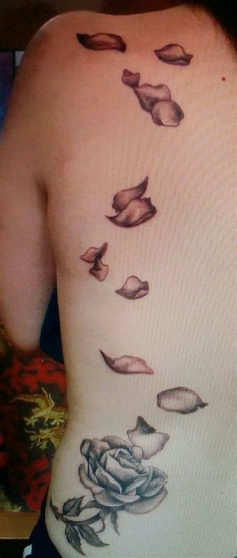 Flower tattoo with names in petals. Rose or flower on top flowers falling down names of ...