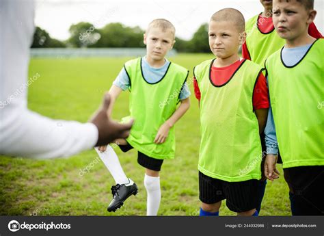 Football Coach Instructing His Students Stock Photo By ©rawpixel 244032986