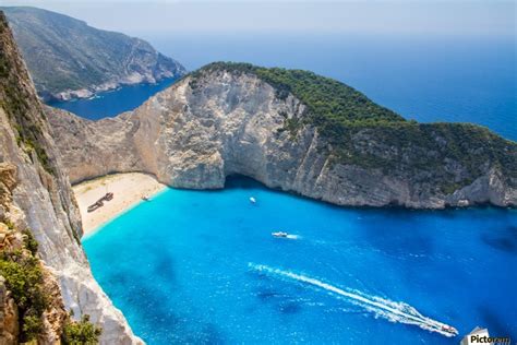 Navagio Beach With Shipwreck Against Sunset On Zakynthos
