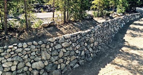 A rock wall is tricky, but if you know the perfect rock wall landscaping plants, you can dress it up right! Retaining Walls by Rock Landscaping, Anchorage Alaska