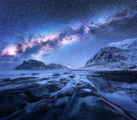 Premium Photo Milky Way Above Frozen Sea Coast And Snow Covered Mountains