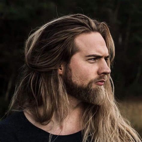 This look is a good choice if you like the look of long hair but don't want it in your face. 20 Best Blonde Beards to Try Right Now - BeardStyle