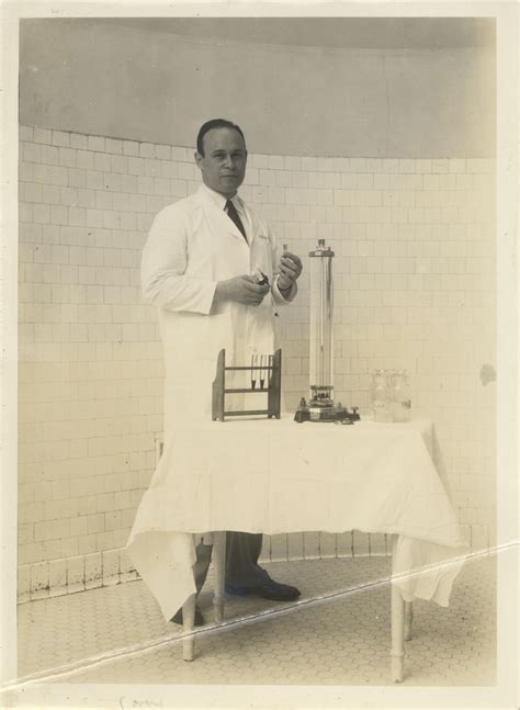 [Charles Drew with laboratory apparatus]. Photographic Print. 1 Image