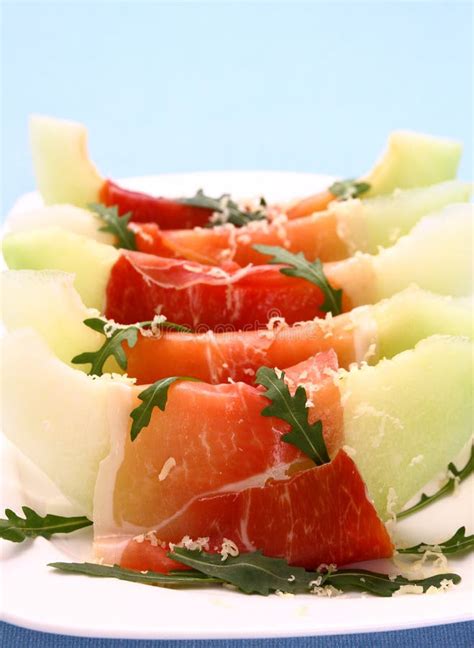 Ripe Melon With Ham Parmesan On White Plate Cheese Stock Photo