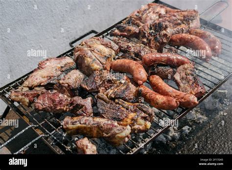 Argentinian Grilled Meat Cooking Asado Argentino Stock Photo Alamy