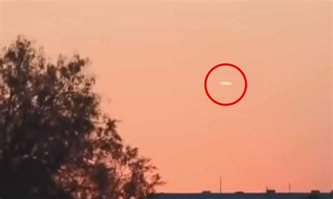 Mysterious Cigar Shaped Ufo Spotted Hovering In The Sky Daily Mail