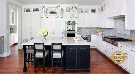 However, they aren't right for every kitchen. Traditional white kitchen with dark stained island